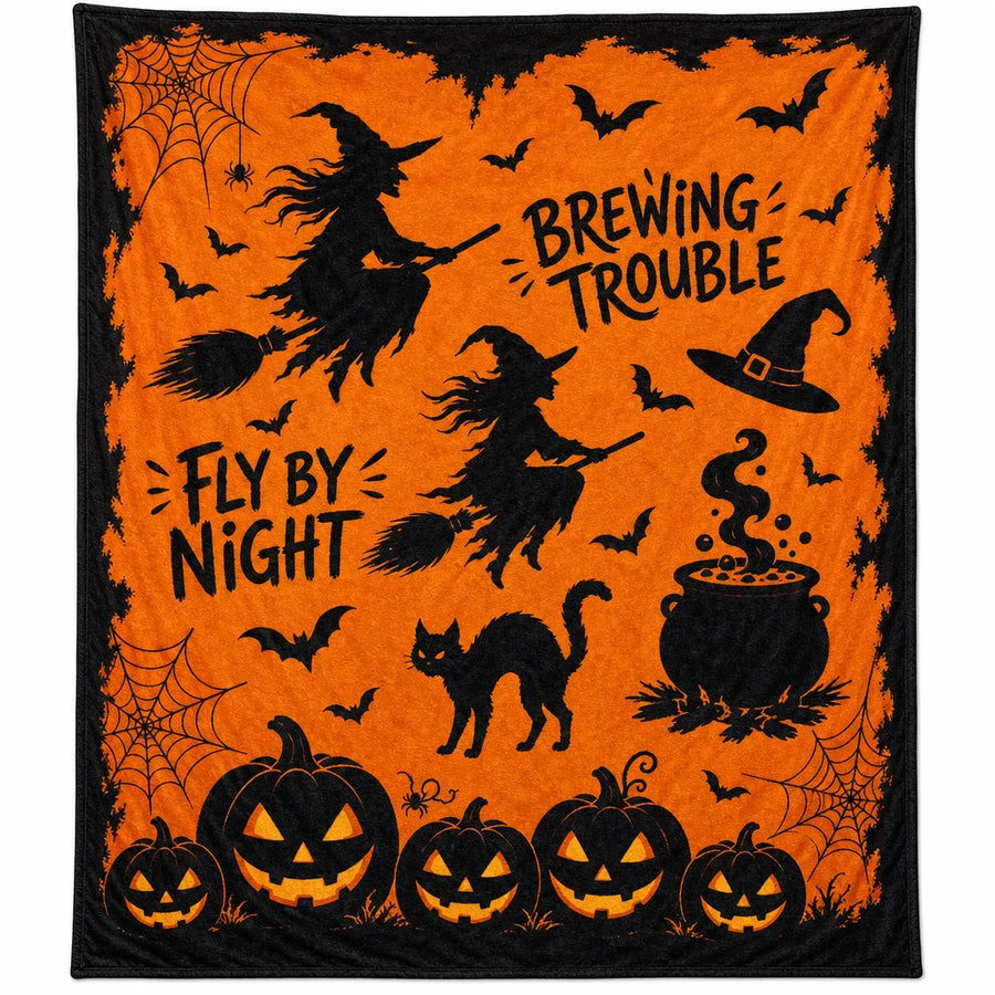 The throw fully unfolded from above, the whole orange print edge to edge