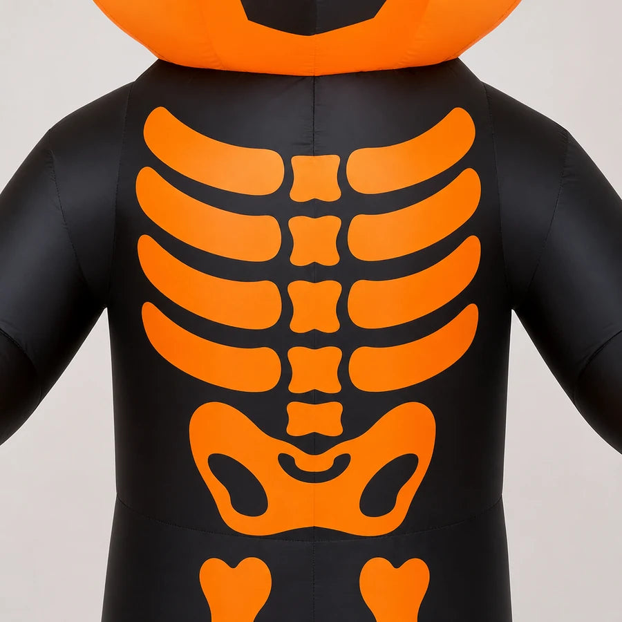 Macro of the lit orange ribcage against the black robe, string lights woven through the ribs