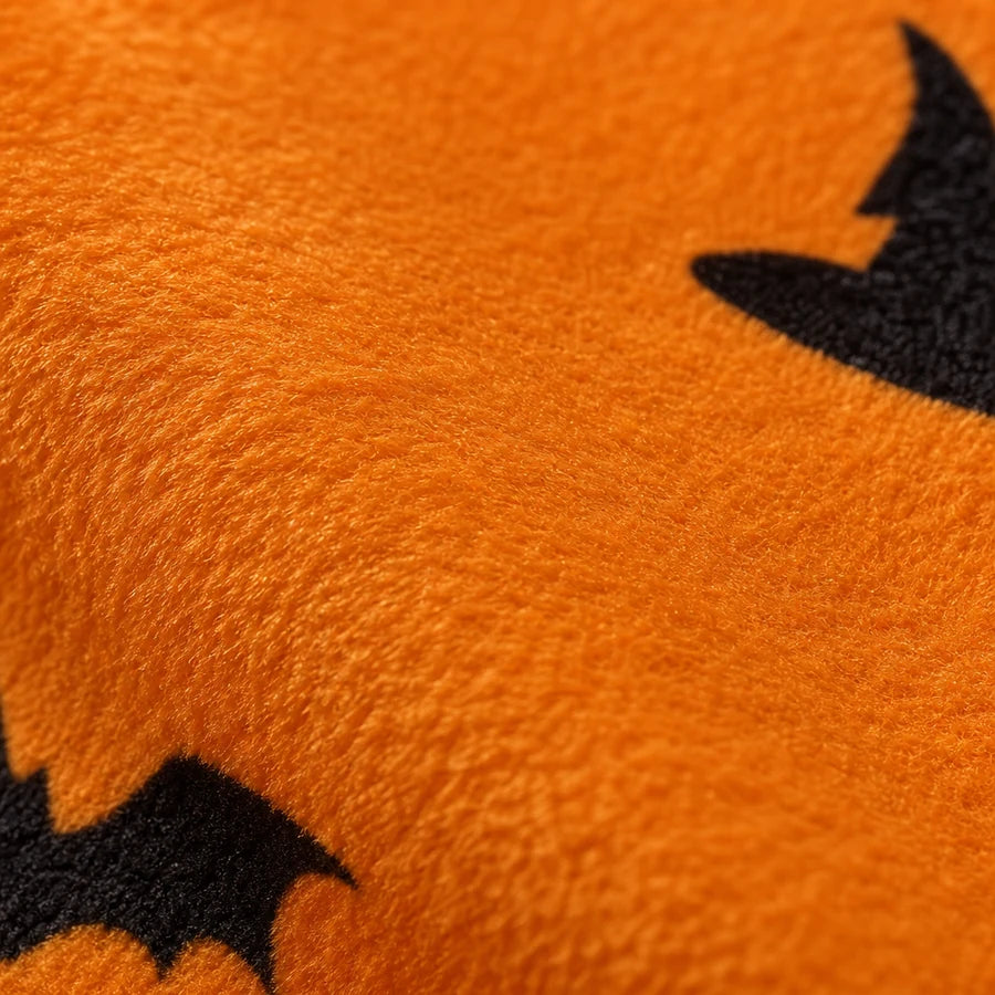 Close on the brushed orange plush, the raised fibres catching the light